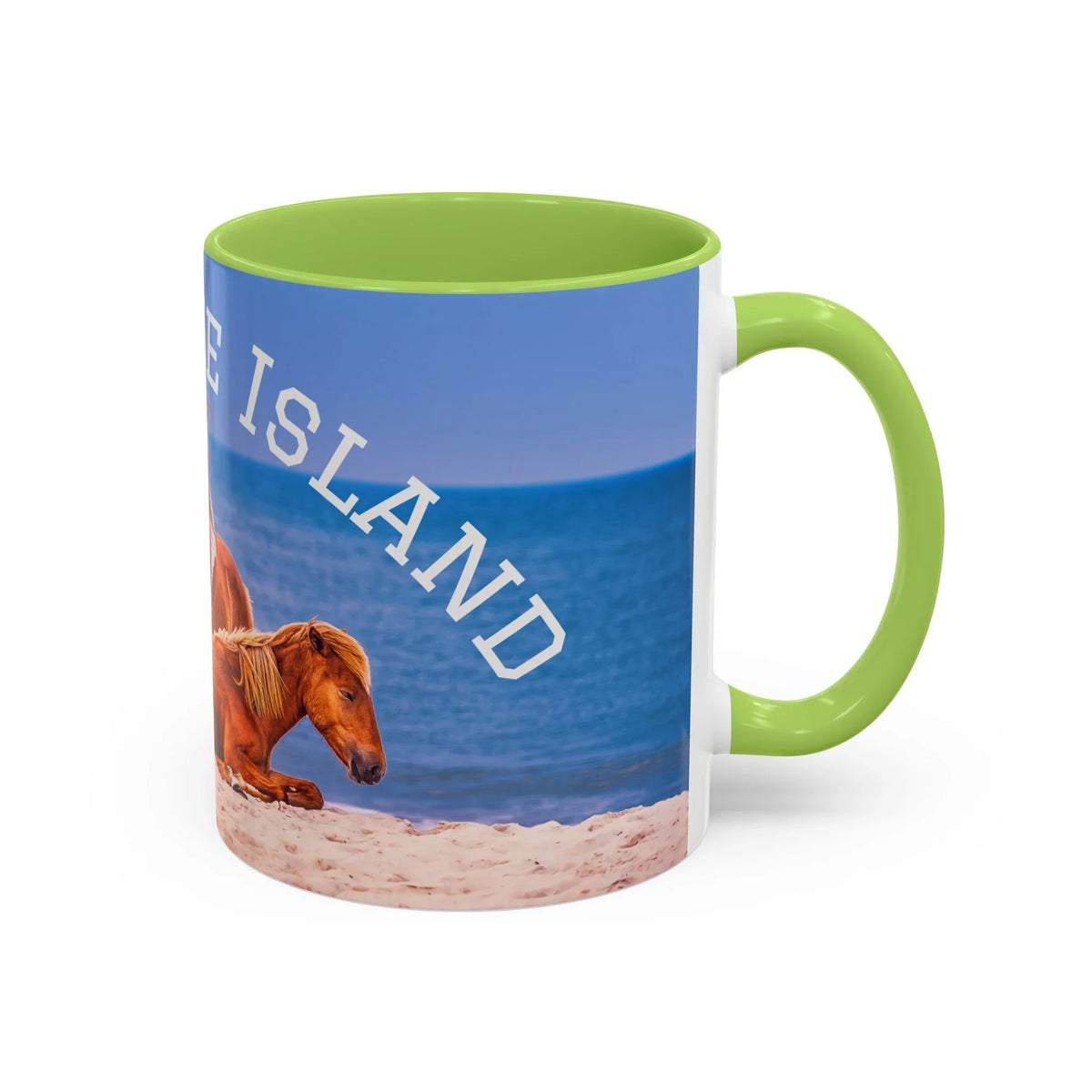 Ceramic coffee mug featuring wild horses on a beach with blue ocean and 'ISLAND' text.
