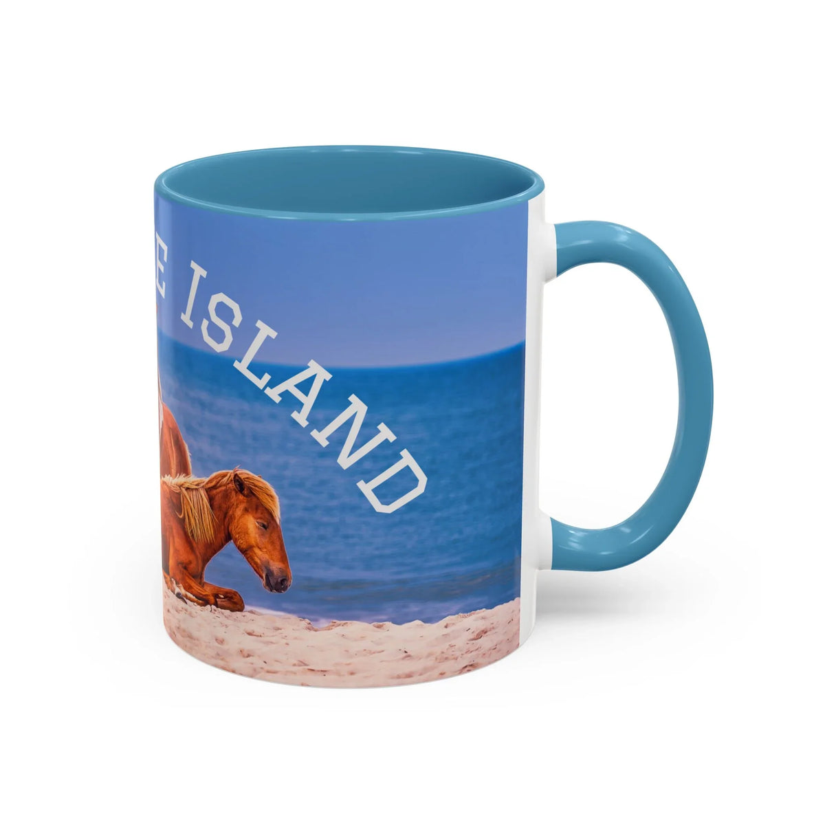 Jeff H Travels ceramic coffee mug featuring wild horses on a sandy beach with blue ocean.