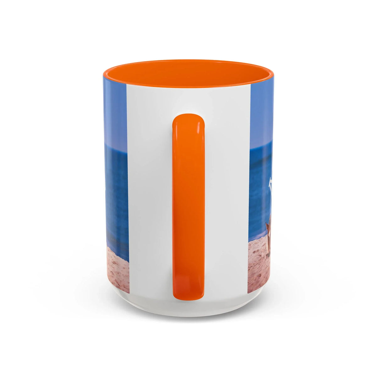 Ceramic coffee mug with beach scene and wild horse decor, featuring an orange handle.
