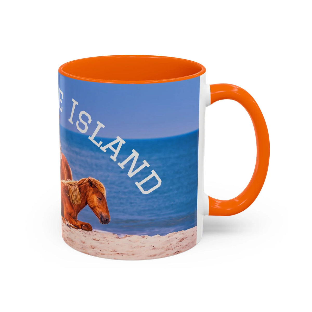 Orange-rimmed ceramic mug featuring wild horses on a beach with 'ISLAND' text.