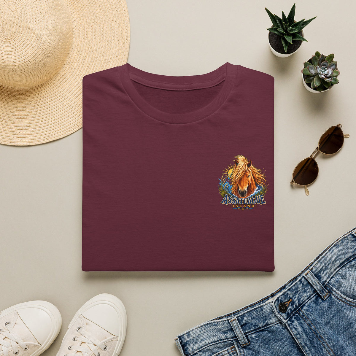 Maroon t-shirt featuring an Assateague Island wild horse graphic design.