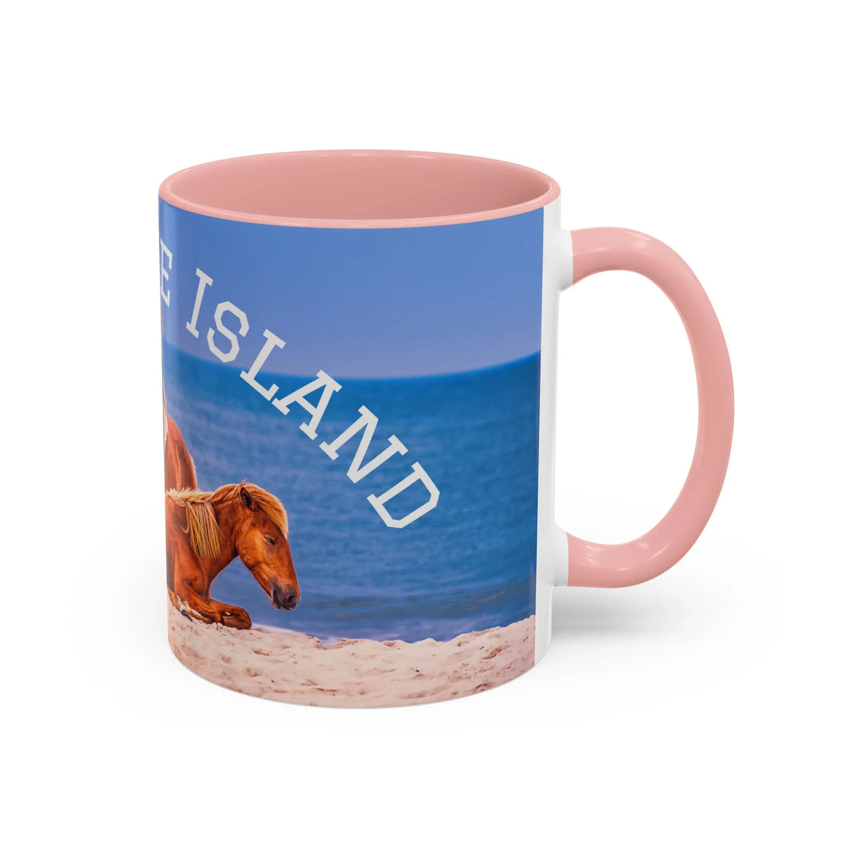 Ceramic coffee mug featuring wild horses on a beach with blue ocean and pink interior.